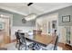Elegant dining room features hardwood floors, large table and view into adjoining rooms at 265 Beverly Farms Dr, Sharpsburg, GA 30277