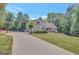Lovely two-story home with a spacious driveway and beautiful landscaping at 265 Beverly Farms Dr, Sharpsburg, GA 30277