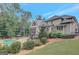 Exterior view of home showcasing the screened porch, landscaped yard, and swimming pool at 265 Beverly Farms Dr, Sharpsburg, GA 30277