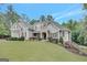 Charming gray home on a lush green lawn with a basketball hoop and a landscaped yard at 265 Beverly Farms Dr, Sharpsburg, GA 30277