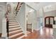Grand Foyer with hardwood floors, staircase and arched doorway at 265 Beverly Farms Dr, Sharpsburg, GA 30277