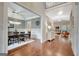 Open foyer with hardwood floors leading to dining, living room, and staircase to the second floor at 265 Beverly Farms Dr, Sharpsburg, GA 30277