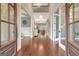 Grand foyer featuring gleaming hardwood floors, soaring ceilings, and elegant lighting at 265 Beverly Farms Dr, Sharpsburg, GA 30277
