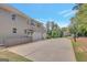 The rear of a lovely home with a three-car garage and long driveway is pictured at 265 Beverly Farms Dr, Sharpsburg, GA 30277