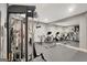 Well equipped exercise room with a full array of machines and mirrors for home fitness at 265 Beverly Farms Dr, Sharpsburg, GA 30277