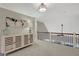 Hallway featuring a console table, carpeted floors, and a decorative light fixture at 265 Beverly Farms Dr, Sharpsburg, GA 30277