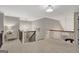Upper hallway with carpeted floors, decorative light fixtures, and railing overlooking the lower level at 265 Beverly Farms Dr, Sharpsburg, GA 30277