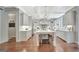 Spacious kitchen boasting white cabinets, large island, and hardwood floors at 265 Beverly Farms Dr, Sharpsburg, GA 30277