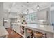 Bright kitchen with white cabinets, granite countertops, stainless appliances, and a large center island at 265 Beverly Farms Dr, Sharpsburg, GA 30277