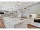 Large kitchen island with seating, stainless steel appliances, and custom cabinetry makes cooking and entertaining easy at 265 Beverly Farms Dr, Sharpsburg, GA 30277