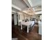 Bright kitchen with a center island, elegant pendant lighting, and stainless steel refrigerator at 265 Beverly Farms Dr, Sharpsburg, GA 30277