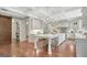 Bright, spacious kitchen with large island, white cabinets, and a sliding barn door at 265 Beverly Farms Dr, Sharpsburg, GA 30277