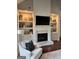 This living room features a fireplace with custom built-ins and modern finishes at 265 Beverly Farms Dr, Sharpsburg, GA 30277