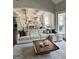 Inviting living room featuring modern furniture, open layout, and seamless flow to other rooms at 265 Beverly Farms Dr, Sharpsburg, GA 30277