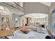 Bright living room with open floor plan, fireplace, hardwood floors, and a view of the kitchen and dining area at 265 Beverly Farms Dr, Sharpsburg, GA 30277