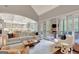 Expansive living room with fireplace, built-in shelving, and easy access to the kitchen and screened porch at 265 Beverly Farms Dr, Sharpsburg, GA 30277