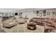 Spacious living area featuring an area rug, leather furniture, and overhead lighting at 265 Beverly Farms Dr, Sharpsburg, GA 30277
