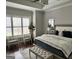 This spacious main bedroom features hardwood floors and a sitting area with natural light at 265 Beverly Farms Dr, Sharpsburg, GA 30277
