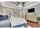 Relaxing main bedroom with ample closet space, neutral tones, and a modern ceiling fan at 265 Beverly Farms Dr, Sharpsburg, GA 30277