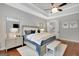 Inviting main bedroom with tray ceiling, warm hardwood floors, and elegant decor at 265 Beverly Farms Dr, Sharpsburg, GA 30277