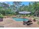 Stunning in-ground pool with landscaped surroundings and a relaxing lounge area; perfect for outdoor enjoyment at 265 Beverly Farms Dr, Sharpsburg, GA 30277