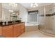Well-appointed bathroom featuring a soaking tub, glass-enclosed shower, and a wooden vanity at 931 Hidden Falls Se Ln, Smyrna, GA 30082