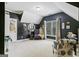 Stylish bedroom featuring dark walls, ample natural light and cozy seating area at 931 Hidden Falls Se Ln, Smyrna, GA 30082
