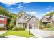 Charming two-story home with a well-manicured lawn and attached two-car garage at 931 Hidden Falls Se Ln, Smyrna, GA 30082