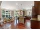 Expansive kitchen with hardwood floors, dark cabinetry, an island, and a dining area perfect for entertaining at 931 Hidden Falls Se Ln, Smyrna, GA 30082