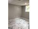Finished basement with marble floors and a window at 3858 Trenton Dr, Snellville, GA 30039