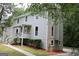 Two-story home with a covered front porch and landscaped yard at 3858 Trenton Dr, Snellville, GA 30039