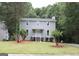 Charming two-story home with a well-maintained lawn and inviting front porch at 3858 Trenton Dr, Snellville, GA 30039