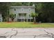 Charming two-story home with a well-maintained lawn and inviting front porch at 3858 Trenton Dr, Snellville, GA 30039