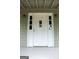 Close up of front door with glass features and sconces at 3858 Trenton Dr, Snellville, GA 30039