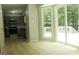Bright kitchen with tile floors next to deck access featuring sliding glass doors and updated appliances at 3858 Trenton Dr, Snellville, GA 30039
