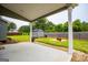 Covered patio overlooking a grassy backyard with a shed and wooden fence at 309 Dean Ct, Temple, GA 30179