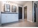 Bathroom featuring double vanity with black door leading to the closet at 309 Dean Ct, Temple, GA 30179