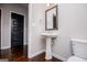 Powder room featuring a pedestal sink and framed mirror at 309 Dean Ct, Temple, GA 30179