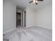 Bedroom with a ceiling fan, stairs, and closet entrance at 309 Dean Ct, Temple, GA 30179