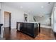 Kitchen island boasts stainless steel dishwasher and quartz countertop, enhancing the functionality of this gourmet kitchen at 309 Dean Ct, Temple, GA 30179