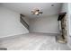A spacious living room features a stone fireplace, carpeted floors, and plenty of natural light at 309 Dean Ct, Temple, GA 30179