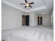 The spacious primary bedroom features carpeted floors, ample natural light, and a tray ceiling at 309 Dean Ct, Temple, GA 30179