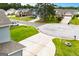 Street view of a residential neighborhood with well-maintained lawns and sidewalks at 309 Dean Ct, Temple, GA 30179