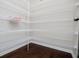 A walk-in pantry featuring white wire shelving and hardwood floors provides ample storage space at 309 Dean Ct, Temple, GA 30179