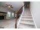 A carpeted staircase with wood and iron railings leads to the upper level of the home at 309 Dean Ct, Temple, GA 30179