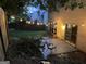 Inviting backyard patio with string lights, perfect for outdoor lounging and entertaining in a private setting at 2938 Cottesford Se Way, Smyrna, GA 30080