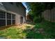 Backyard view with a small patio, green grass, and a fenced perimeter at 2938 Cottesford Se Way, Smyrna, GA 30080