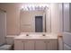 Bathroom featuring a double sink vanity, a large mirror, and a commode at 2938 Cottesford Se Way, Smyrna, GA 30080