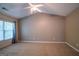 Spacious bedroom with a vaulted ceiling, ceiling fan, large window, and plush carpet at 2938 Cottesford Se Way, Smyrna, GA 30080