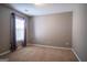 Neutral bedroom featuring a window with blinds and curtains plus beige carpet flooring at 2938 Cottesford Se Way, Smyrna, GA 30080
